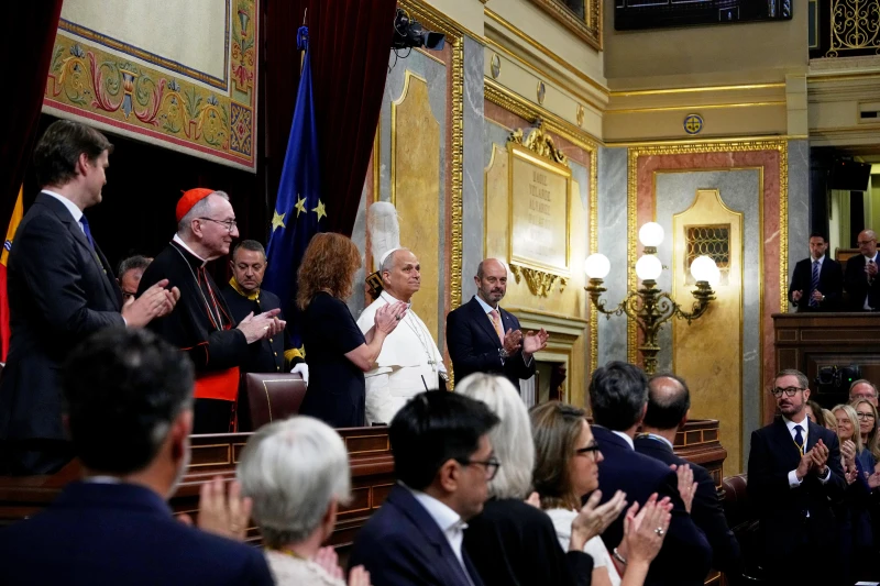 Pope’s historic speech to Spain’s parliament demands respect for migrants and gets 7-minute ovation